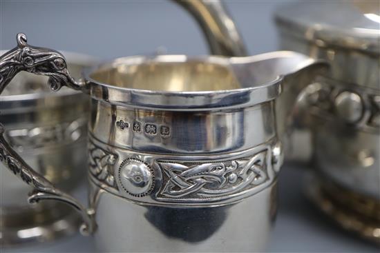 A George V Arts & Crafts silver three piece tea set, A.E Poston & Co Ltd, Birmingham, 1935, gross 31.5 oz.